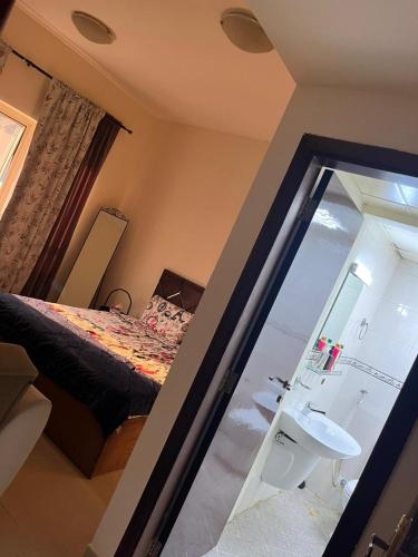 a bedroom with a bed and a sink and a window at Pure zamzam Guest House At Al nahda Sharjah Dubai Border-FAMILY ONLY in Sharjah