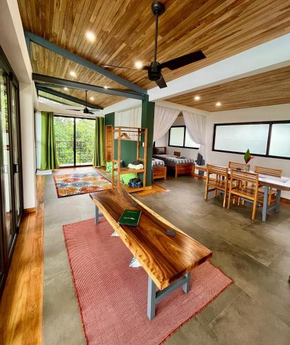 a living room with a wooden table and a couch at Southern Drake Lodge in Drake