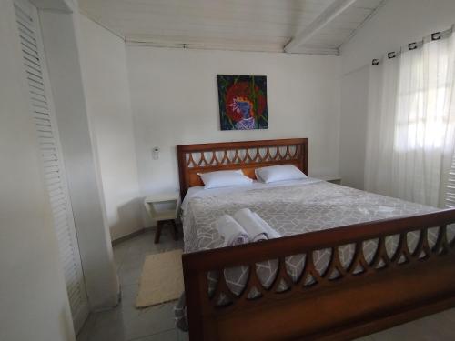 En eller flere senge i et værelse på La Peregrina - Bangalô Superior