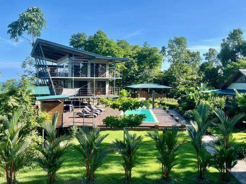 a house with a swimming pool and a resort at Southern Drake Lodge in Drake