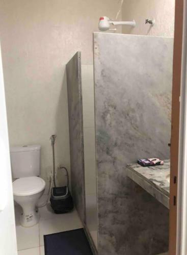 a bathroom with a toilet and a shower stall at Suíte 101 - Pousada no Centro do Rio in Rio de Janeiro