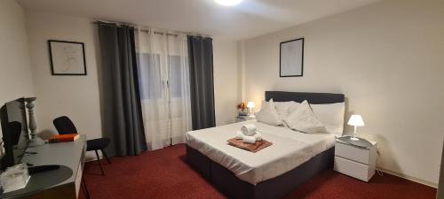 Postel nebo postele na pokoji v ubytování Hotel Garni