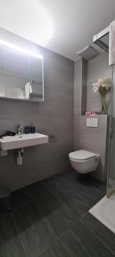 Koupelna v ubytování Hotel Garni