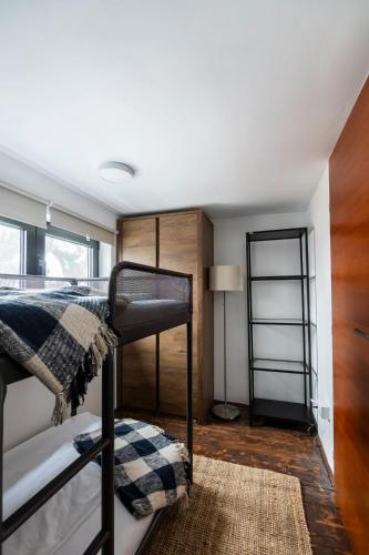 a bedroom with a bunk bed and a lamp at Kežman Mountain Houses in Kopaonik