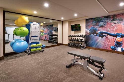 a fitness room with a gym with a large painting at Residence Inn by Marriott Sedona in Sedona