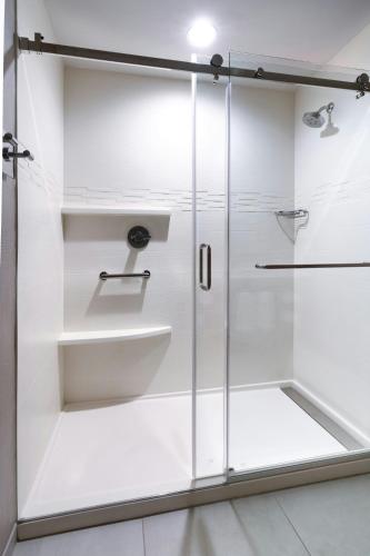 a bathroom with a shower with white walls at Residence Inn by Marriott Sedona in Sedona