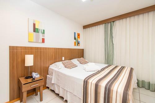 Ένα ή περισσότερα κρεβάτια σε δωμάτιο στο Nobile Hotel em Brasília 03832