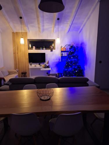 a living room with a christmas tree and a table at Quinta da Feteira - Conforto, Aventura, Saúde in Maiorais
