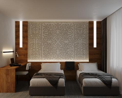 a hotel room with two beds and a wall at Duo Hotel by Futuro in Bishkek