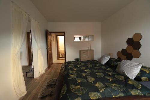 Postel nebo postele na pokoji v ubytování ApaHouse