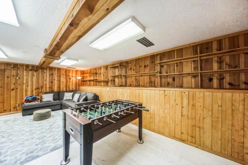 a living room with a ping pong table in the middle at Famed Plaza Oasis 1 mile away, King Bed, Office, Foosball in Santa Fe