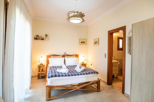 a bedroom with a bed in a room at Olive Studios Karpathos Studio #1 in Karpathos Town