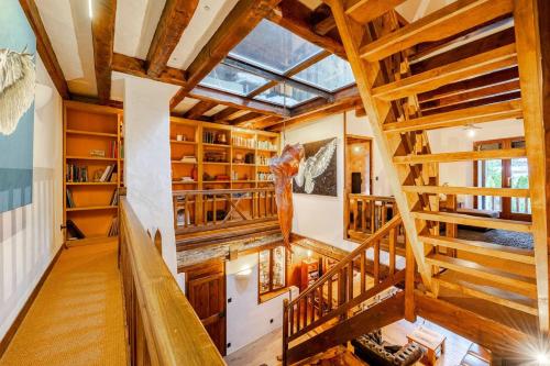 an overhead view of a room with wooden stairs at Marmotte Mountain Manor in Chamonix-Mont-Blanc