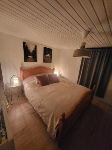 Postel nebo postele na pokoji v ubytování Le Grand Cerf gîte citadin