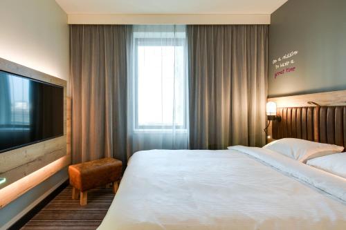 Letto o letti in una camera di Moxy Katowice Airport