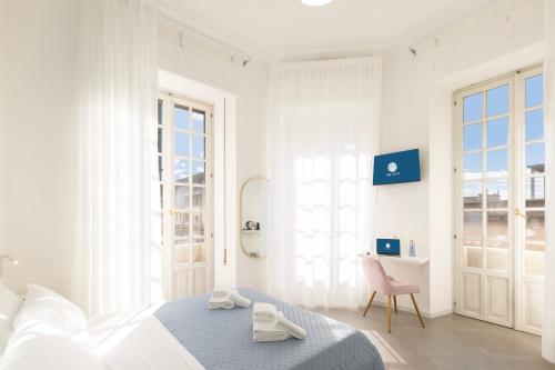 Ένα ή περισσότερα κρεβάτια σε δωμάτιο στο Maddalena Rooms - Eja Sardinia