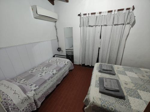 Ένα ή περισσότερα κρεβάτια σε δωμάτιο στο Departamento Gise