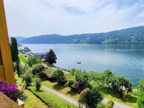 a view of a lake from a balcony at Pension Sedlak in Millstatt