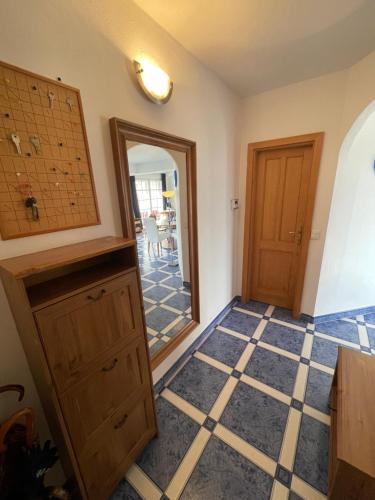 a room with a door and a tiled floor at Villa Vista Pannonia in Donnerskirchen