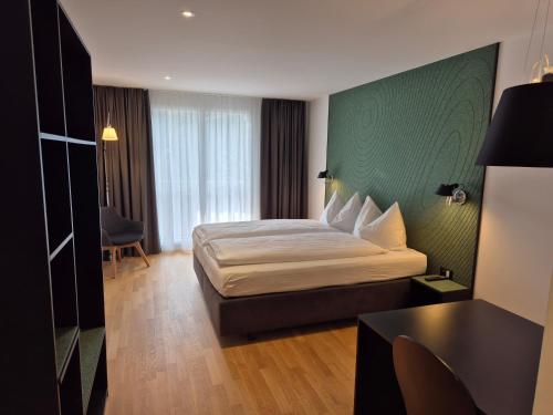 Postel nebo postele na pokoji v ubytování CENTRINO Apartments