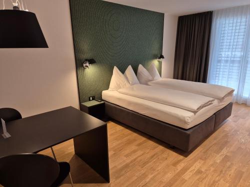 Postel nebo postele na pokoji v ubytování CENTRINO Apartments