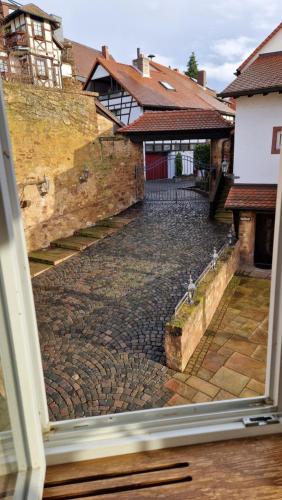 a view of a cobblestone street from a window at Alte Pfarrey in Neuleiningen