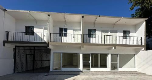 a large white building with a balcony on it at Apartamentos la medero 4 in Nuevo Laredo