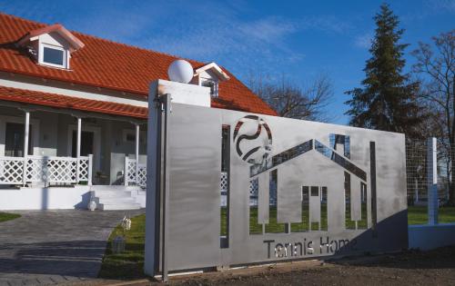 a sign in front of a house at Tennis Home-Pozar, Piperia! in Áno Rodoniá