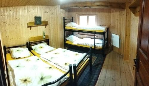 Postel nebo postele na pokoji v ubytování Statek Kachliřka