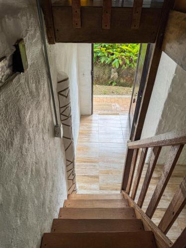 a stairway leading up to a building with a stair case at Hostal Pachamama in San Agustín
