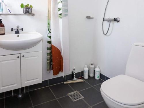 a bathroom with a toilet and a sink at Beachfront Bliss in Hurup - By Traum Ferienwohnungen in Hadsund