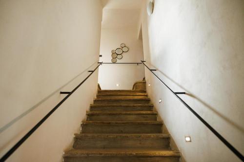 a staircase in a building with a bunch of spheres on the wall at Horní Strakův mlýn in Úštěk
