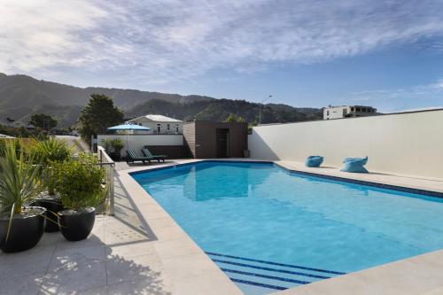 a swimming pool on the side of a house at Edit Picton in Picton