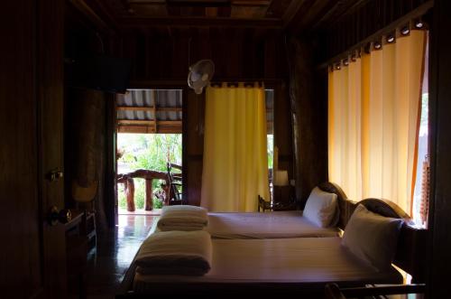 Кровать или кровати в номере Daranee Resort