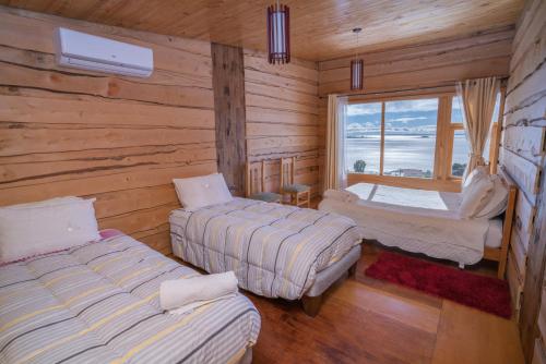 Postel nebo postele na pokoji v ubytování Hotel Boutique Antukenu