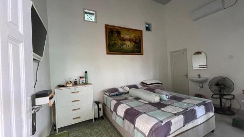 Postel nebo postele na pokoji v ubytování Petra Garden