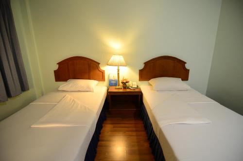 Ranong Garden Hotelにあるベッド