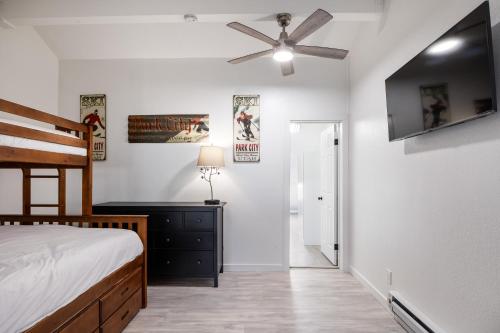 a bedroom with a bed and a ceiling fan at Walk to Main Street and Ski Lifts, Amazing Views, Community Hot Tub! in Park City
