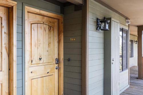 a front door of a house with a sign on it at Walk to Main Street and Ski Lifts, Amazing Views, Community Hot Tub! in Park City