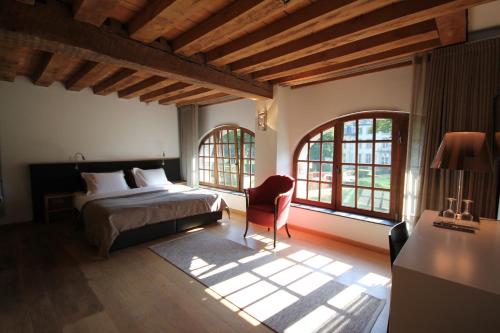 Tempat tidur dalam kamar di B&B Baron’s House Neerijse-Leuven