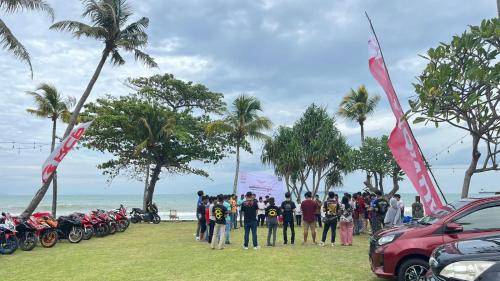 a group of people standing next to a group of motorcycles at Taverno Villa in Serang