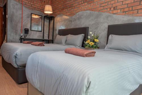 Ένα ή περισσότερα κρεβάτια σε δωμάτιο στο Bricks Guesthouse