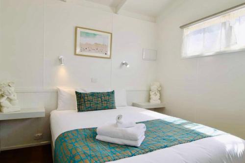 Letto o letti in una camera di Kanasta Caravan Park