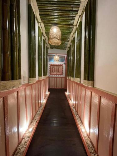 a hallway of a building with a hallwayngthngthngthngthngthngthngthngth at Mahalo Hostel in Salento
