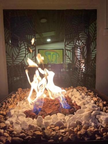 a cake with a fire in the middle at Mahalo Hostel in Salento