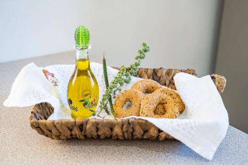 a basket of pretzels and a bottle of beer at Olive Studios Karpathos Studio #4 in Karpathos Town