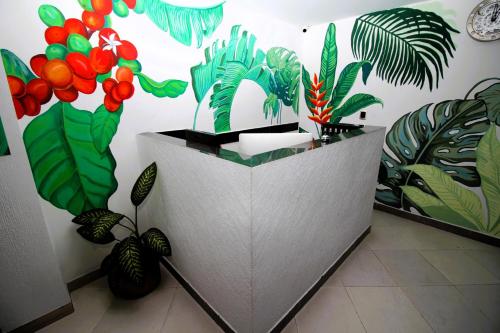 a room with plants on the wall at DAM Hotel Pereira in Pereira