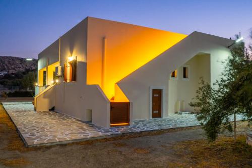 a house with a staircase on the side of it at Olive Studios Karpathos Studio #4 in Karpathos Town