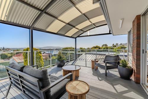 a roof deck with a view of the ocean at Seaview Heights by the BnB Collection in Albany