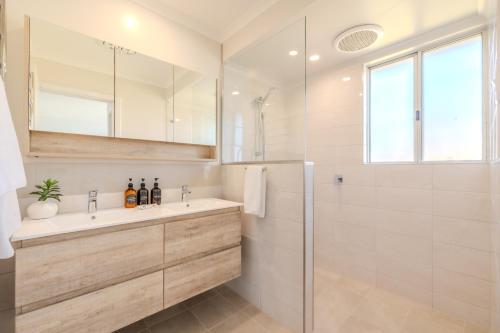 a bathroom with a sink and a shower at Seaview Heights by the BnB Collection in Albany